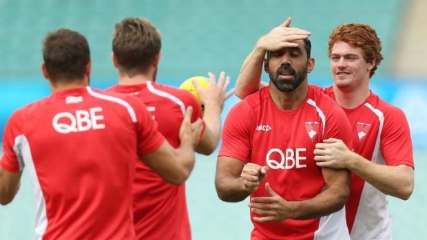 Doing it with his eyes closed: Adam Goodes gets his degree of difficulty raised by Gary Rohan.