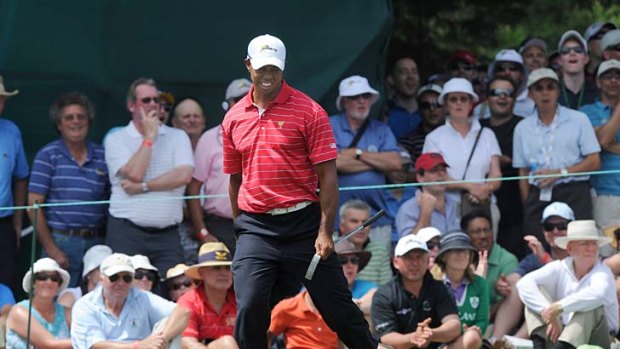 Tiger Woods spins and dances then stops in his tracks after missing an eagle on the 15th.