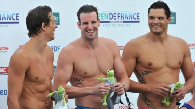 All smiles: French swimmer Florent Manaudou (right) celebrates after winning the men's 50m freestyle, flanked by second-placed James Magnussen and third-placed Cesar Cielo during the Open de France in Bellerive-sur-Allier.