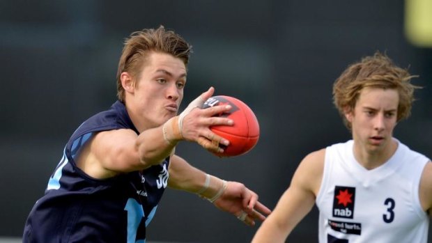 Darcy Moore (left) will play for Collingwood's VFL team on Saturday.