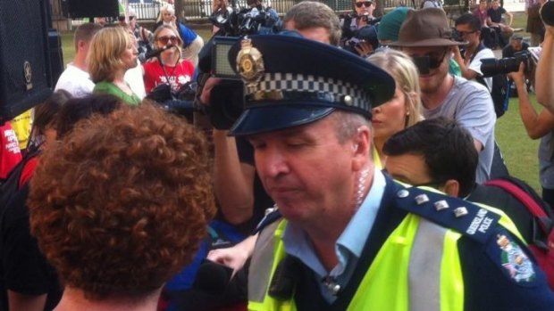 Police move on UQ LNC members who tried to interrupt a protest in Brisbane's Queens Park against increasing university fees.