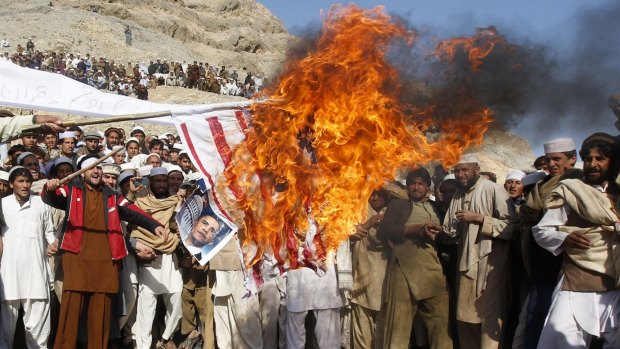 Afghan protesters burn a US flag during a protest in Jalalabad province in Afghanistan in February 2012 against the inadvertent burning of a Koran at a US military base. 