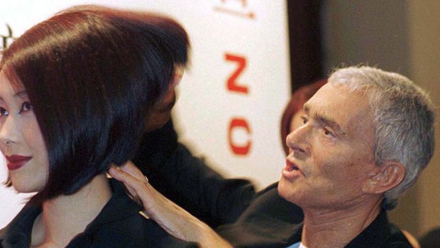 Working his magic ... Vidal Sassoon styles on a model in 1997.