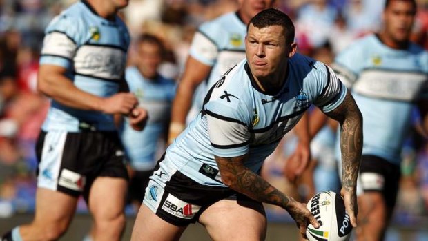 Moving target: Sharks danger man Todd Carney.