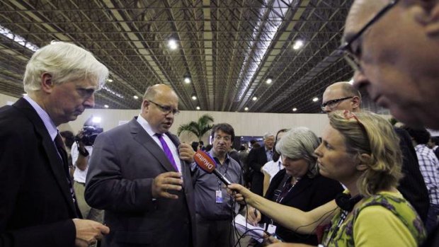 Germany's Environmental Minister Peter Altmaier talks with journalists at the Brazil Pavilion for the Rio+20 United Nations Sustainable Development Summit.