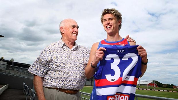 Family affair: Footscray premiership player Harvey Stevens with his grandson Michael Talia, a Western Bulldogs recruit.
