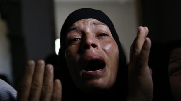 A Palestinian mourner cries at the funeral procession of Mousa Abu Muamer, 56, and his son Saddam, 27, who were killed in an overnight Israeli missile strike at their house in Khan Younis, southern Gaza Strip.