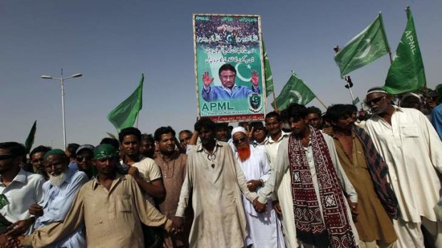 Supporters of Pervez Musharraf gather at Karachi airport.