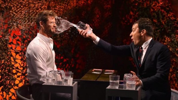 Wet shirt competition ... Chris Hemsworth gets drenched by Jimmy Fallon on The Tonight Show.