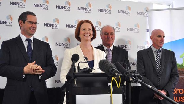 Prime Minister Julia Gillard with Communications Minister Stephen Conroy (left), MP for New England Tony Windsor, and NBN Co CEO Mike Quigley (far right)
