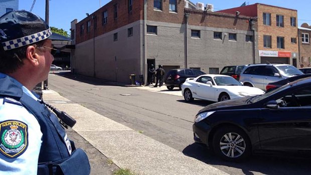 Stand-off: police have sealed off a block in Leichhardt.