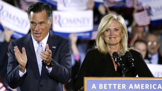 Mitt Romney and wife Ann take the stage at an election night rally in Manchester, New Hampshire.