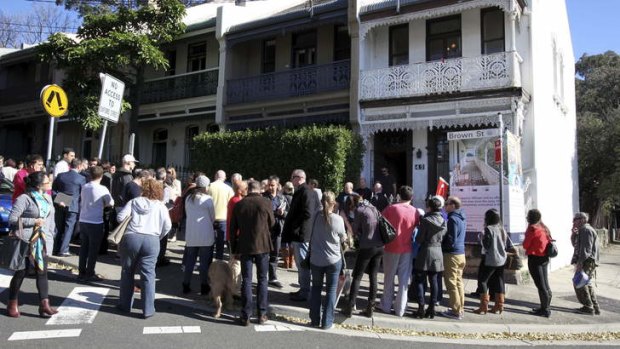 Buyers line up for an auction in Paddington.