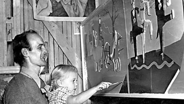 ``Little sibling of the brush''... Jane Olsen aged about four being taught to paint by her father John.