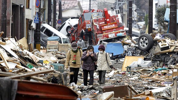 Residents search for their houses among the rubble of Kamaishi, 160 kilometres north-east of Sendai, as the massive clean-up gets under way.