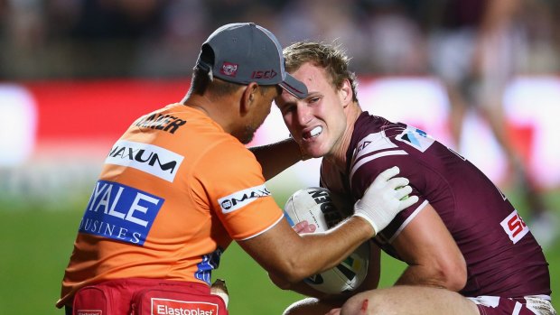 No Origin:  Daly Cherry-Evans receives attention for his shoulder injury during the match against Penrith on Monday.