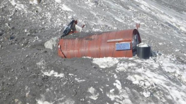 A New Zealand Department of Conservation alpine hut is engulfed by an avalanche that hit Mount Cook on New Zealand's South Island on Wednesday.