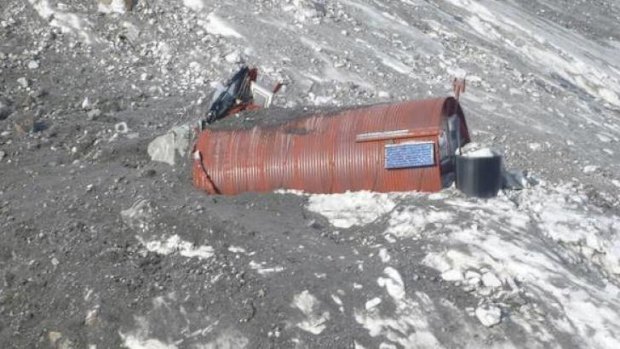 A New Zealand Department of Conservation alpine hut is engulfed by an avalanche that hit Mount Cook on New Zealand's South Island on Wednesday.