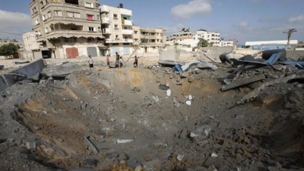 A crater caused by an Israeli air strike in Gaza City on Thursday.
