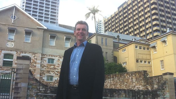 Stewart Armstrong, National Trust of Queensland in front of Brisbane's birthplace on Queens Wharf Road, with 1829 Commissariat Store (left) and the 1866 Immigration Centre (right).