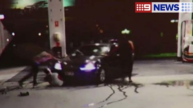 A camera caught the moment a man was run over at a Gold Coast service station.
