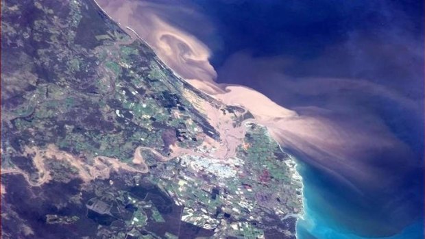 A photo of Bundaberg and the heavily sediment-laden flood plume moving out into the coast from the mouth of the Burnett River during the 2012-2013 wet season.