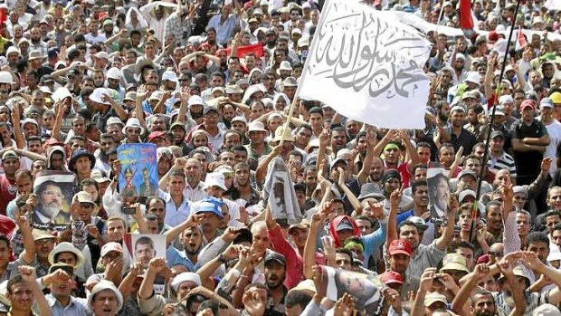Members of the Muslim Brotherhood and supporters of deposed Egyptian President Mohamed Mursi shout slogans outside the at the Rabaa Adawiya square in Cairo.