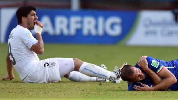 The tooth hurts: Luis Suarez and Giorgio Chiellini after "that" incident at the World Cup.