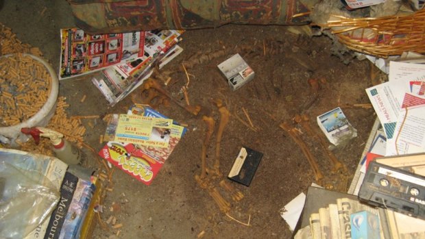 Hospital workers visiting the home of a 79-year-old woman from the Caulfield area found the skeleton of a dead dog, rooms piled with rubbish and discarded cigarettes.