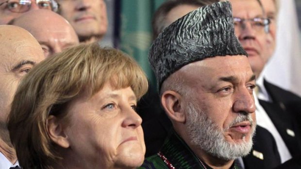 German Chancellor Angela Merkel and Afghan President Hamid Karzai during an international conference on the future of Afghanistan.