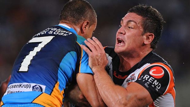 Turning the tables ... Scott Prince tackles Chris Heighington.