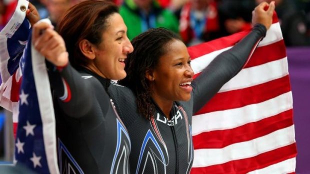 Elana Meyers (L) with Lauryn Williams after winning the silver medal in the bobsled. Meyers wants to play rugby at the Rio Olympics, Williams won a gold medal in athletics at the London Olympics.