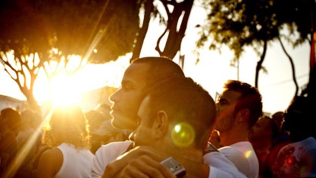 Fight goes on ... Jovanie Narvaez and his partner Mark Vaccarino embrace during a gay marriage rally in West Hollywood.