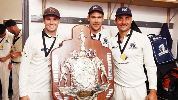 Peter Handscomb, Scott Boland and Marcus Stoinis of the Bushrangers with the Sheffield Shield after beating South Australia last year.