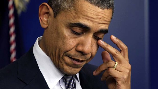 Grief &#8230; a sorrowful Barack Obama faces the media.