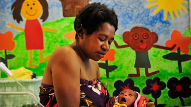 A mother with her newborn baby at Goroka Hospital in the southern highlands of Papua New Guinea.