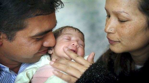 Adi and Bhowana Naulakha with baby Anya.
