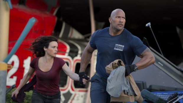 Caught between a Rock and an earthquake: Carla Gugino and Dwayne Johnson in <i>San Andreas</i>.