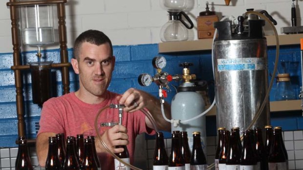 Nolan Hirte at his Footscray factory bottling his cold coffee brew.