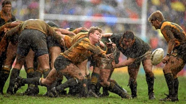 Mud and guts: Ewen McKenzie's Wallabies slug it out at Newlands in their first Test against the Springboks after their readmission to world rugby in 1992. The Wallabies stunned the hosts 26-3 to confirm their status as world champions.