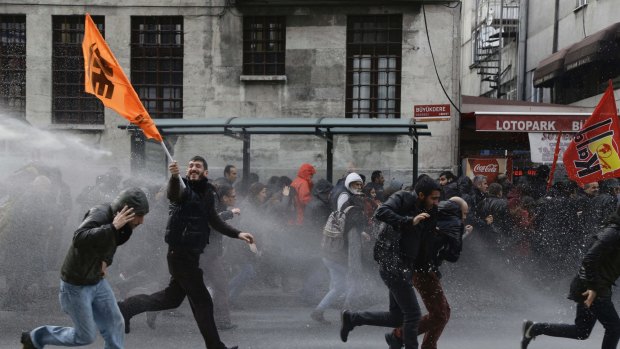 Riot police use water cannon to disperse people protesting the detentions of 12 MPs from the pro-Kurdish Peoples' Democratic Party in Istanbul.