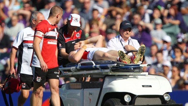 Brendon Goddard is stretchered from the ground. <i>Photo:Getty Images.</i>
