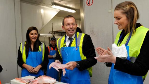 Federal Opposition Leader Tony Abbott visited Melbourne's Wholesale Fish Markets with his wife Margaret and daughters Bridget (right) and Frances.