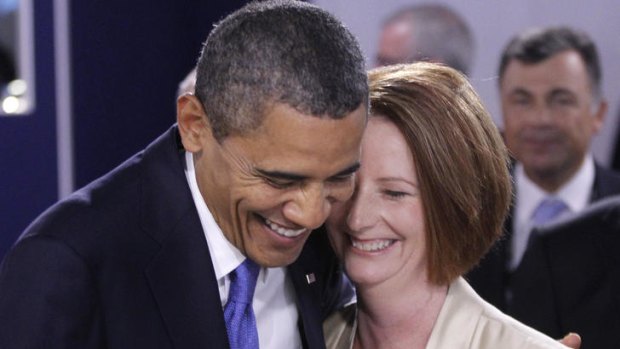Prime Minister Julia Gillard and US President Barack Obama share a warm greeting at the G20 leaders' summit in Cannes, where they spoke about Mr Obama's trip to Australia this month.