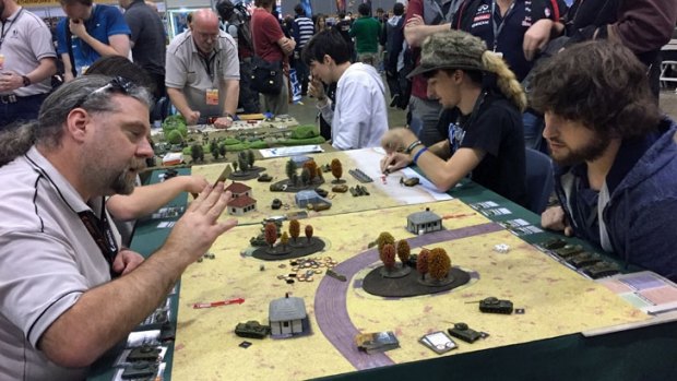 Gamers rolling out the heavy artillery with TANKS in the tabletop section of PAX Australia 2016.