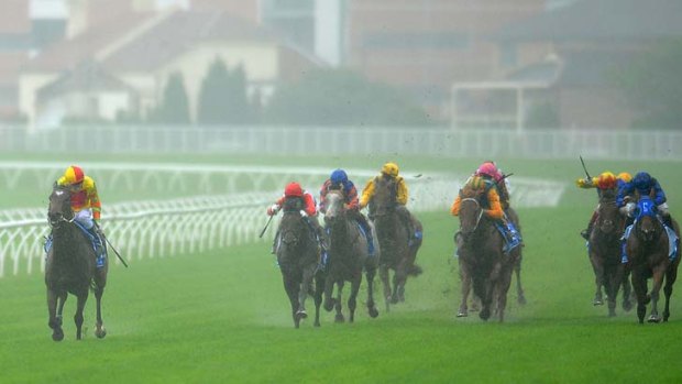 Craig Newitt guides Lankan Rupee (left) to victory in the T. J. Smith Stakes at Randwick on Saturday.