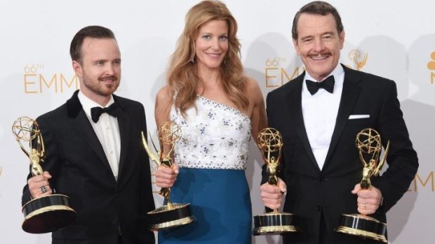 Breaking good: Aaron Paul, Anna Gunn and Bryan Cranston with their Emmy haul for Breaking Bad. 