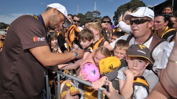 Sign here: Josh Gibson with supporters during the presentation at Glenferrie Oval.