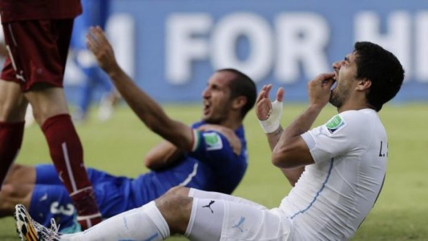 Infamous: Uruguay's Luis Suarez and Italy's Giorgio Chiellini after the biting incident on June 24.