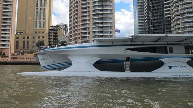 A sideview of the impressive Turanor PlanetSolar as she arrives at Brisbane's CBD.